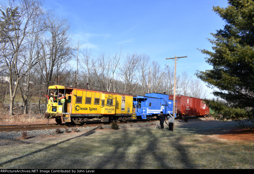 Chessie System Caboose # 904059 and Conrail Caboose # 22130 bringing up the rear of the train-picture taken just east of Lake Station Road 